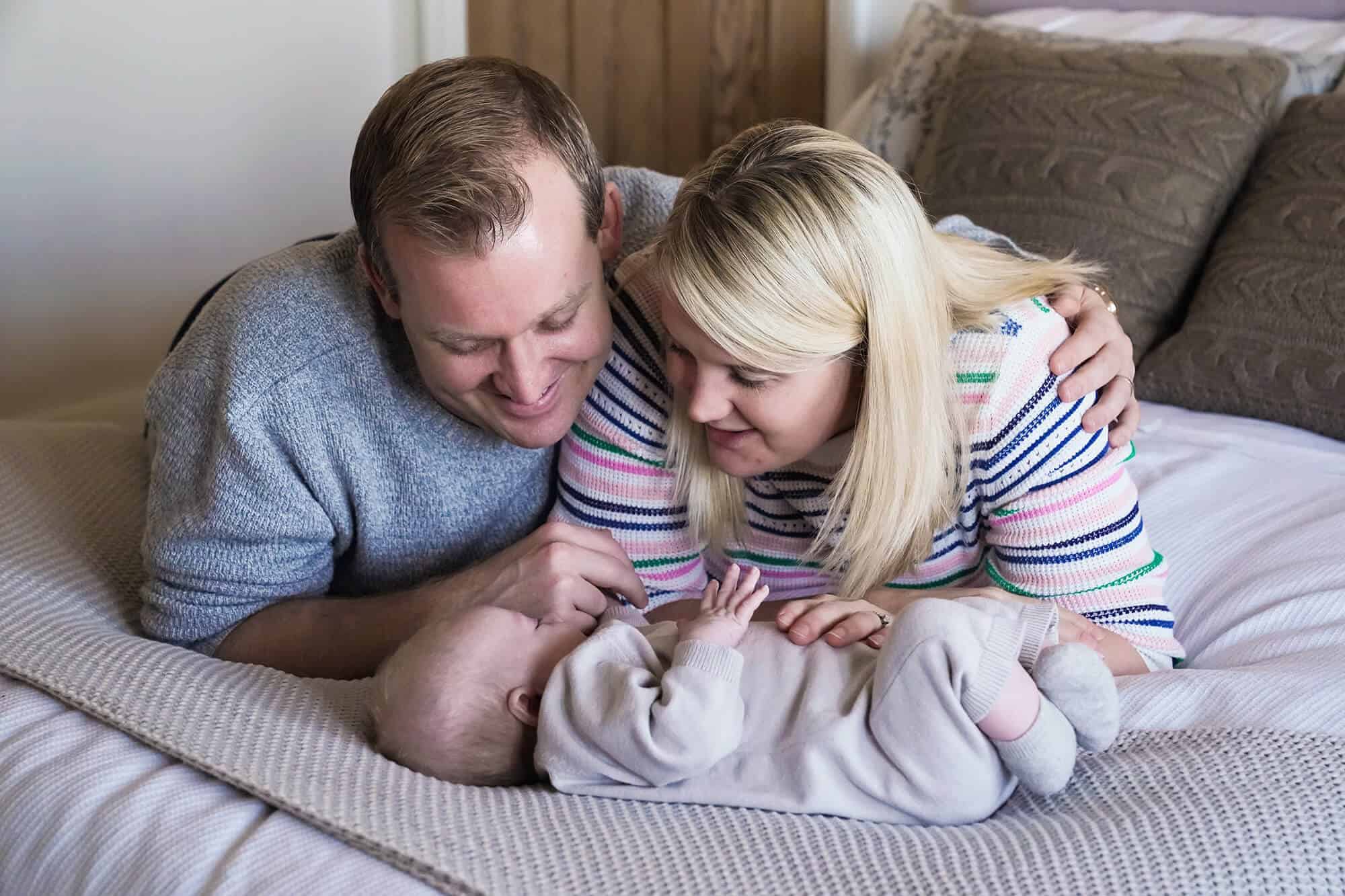 Baby photographer based in Orpington photographing new family at home