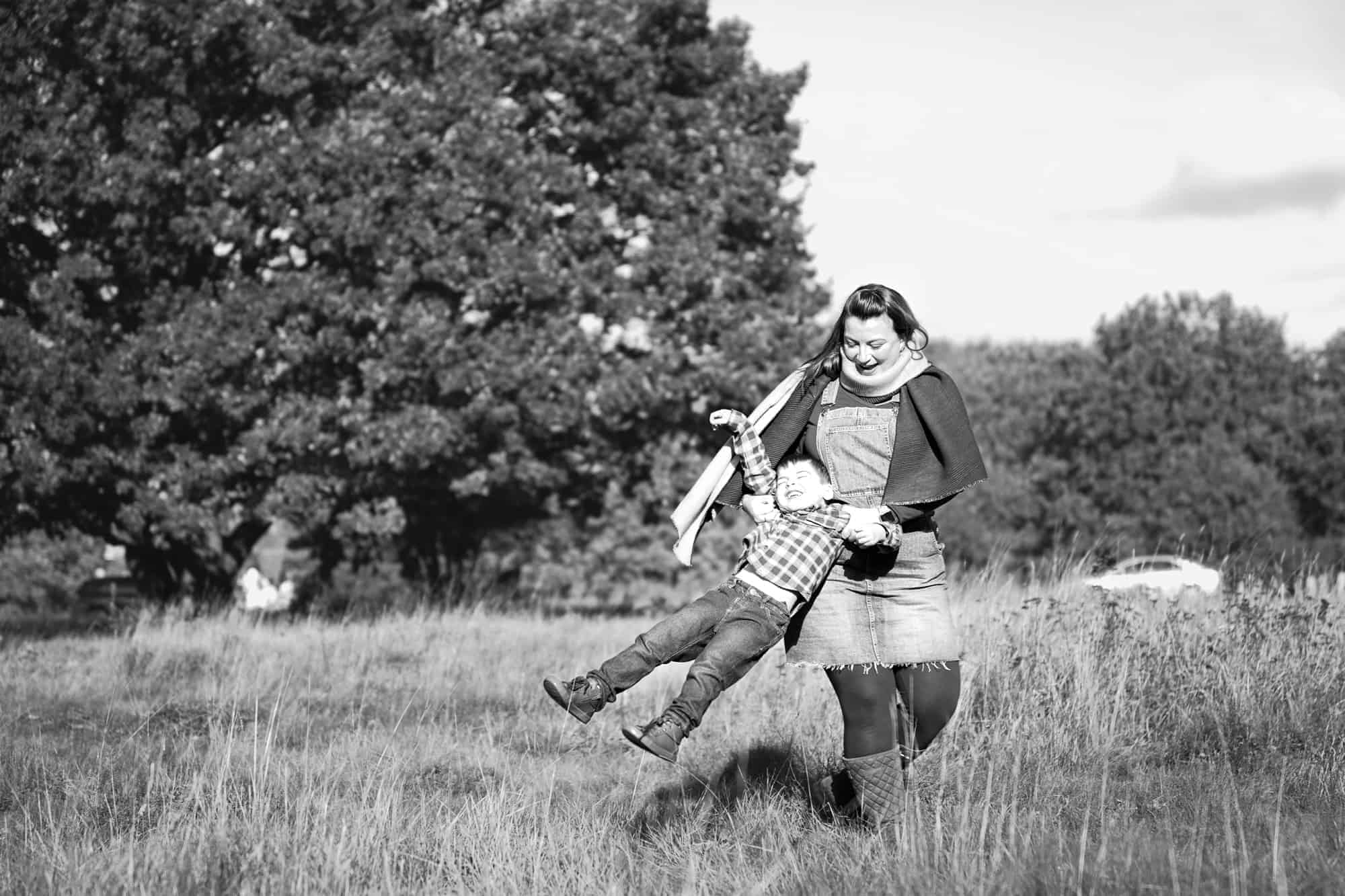 Family photographer from Orpington capturing a family's autumn fun